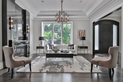 A formal living room trimmed with crown, casing and panel mouldings