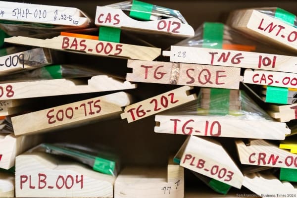 Labelled moulding profile samples stacked in the shop
